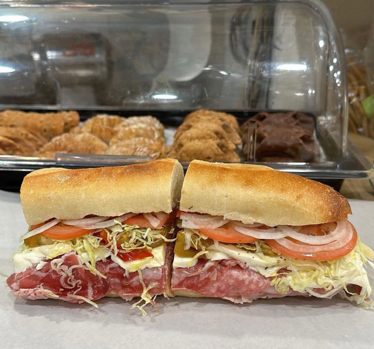 Andrea Salumeria: Italian sub with the deli case behind. Photo from their website.