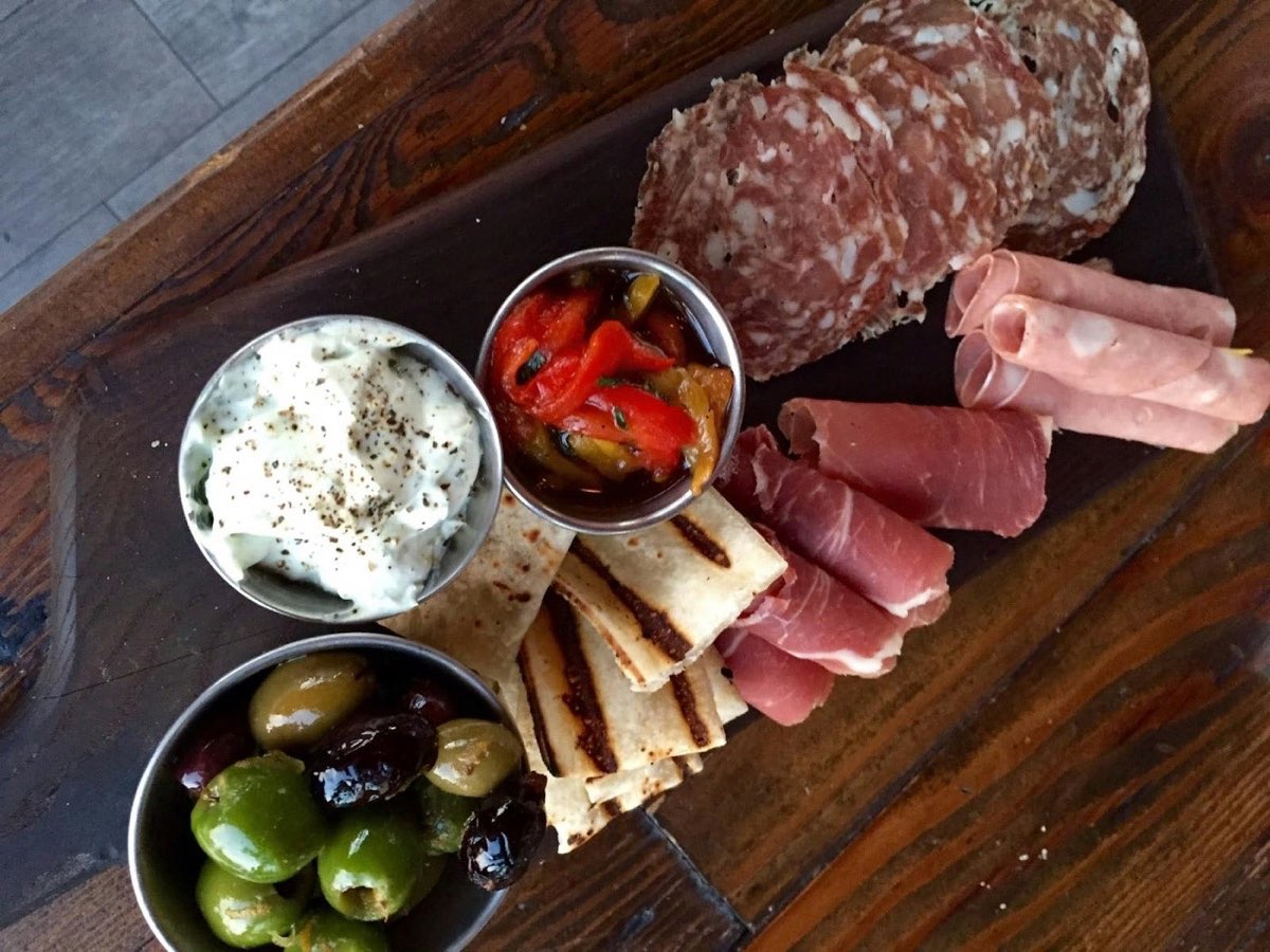Battello: a charcuterie board with cured meats, olives and dips. Photo from their website.