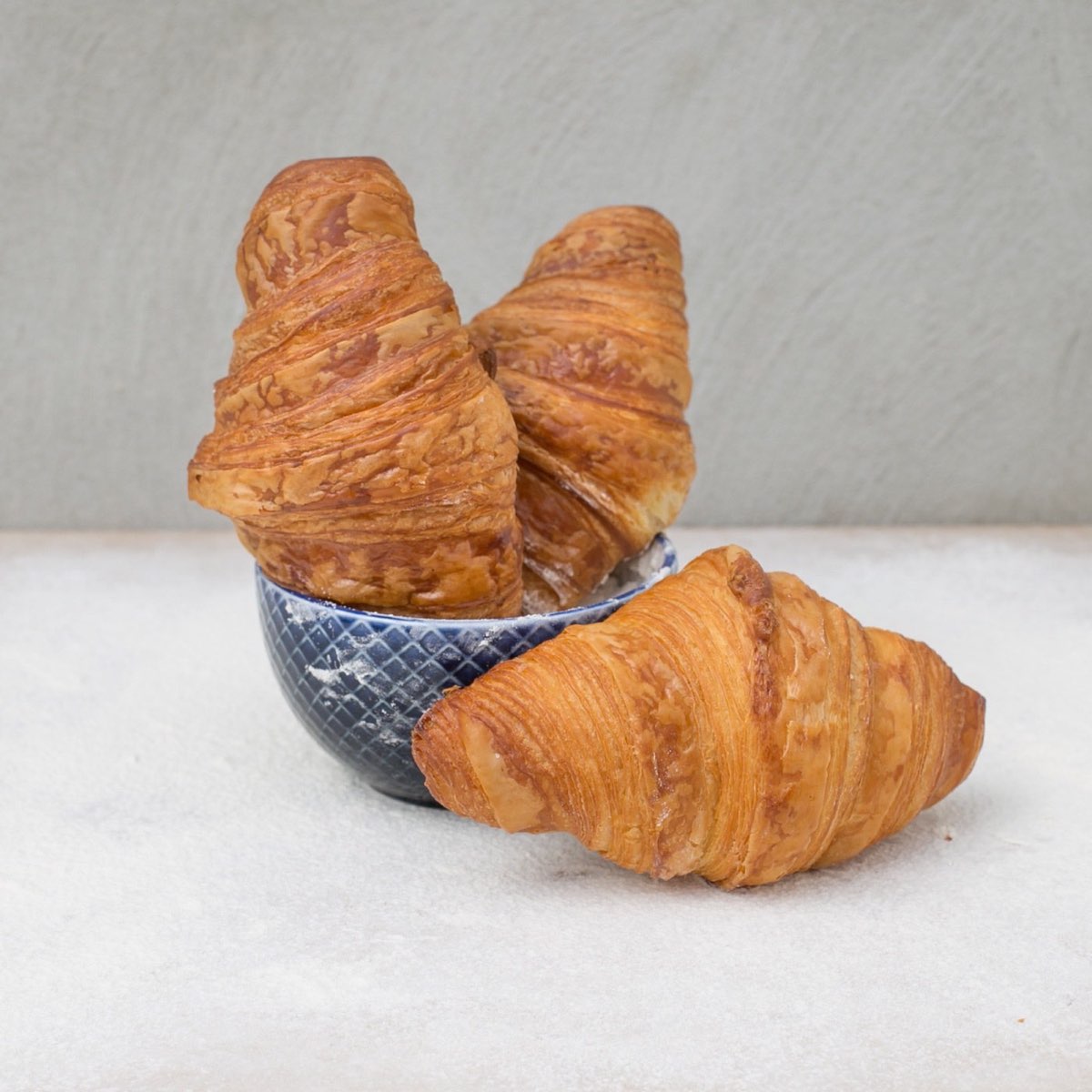 Choc O Pain: three flaky croissants in a blue bowl. Photo from their website.