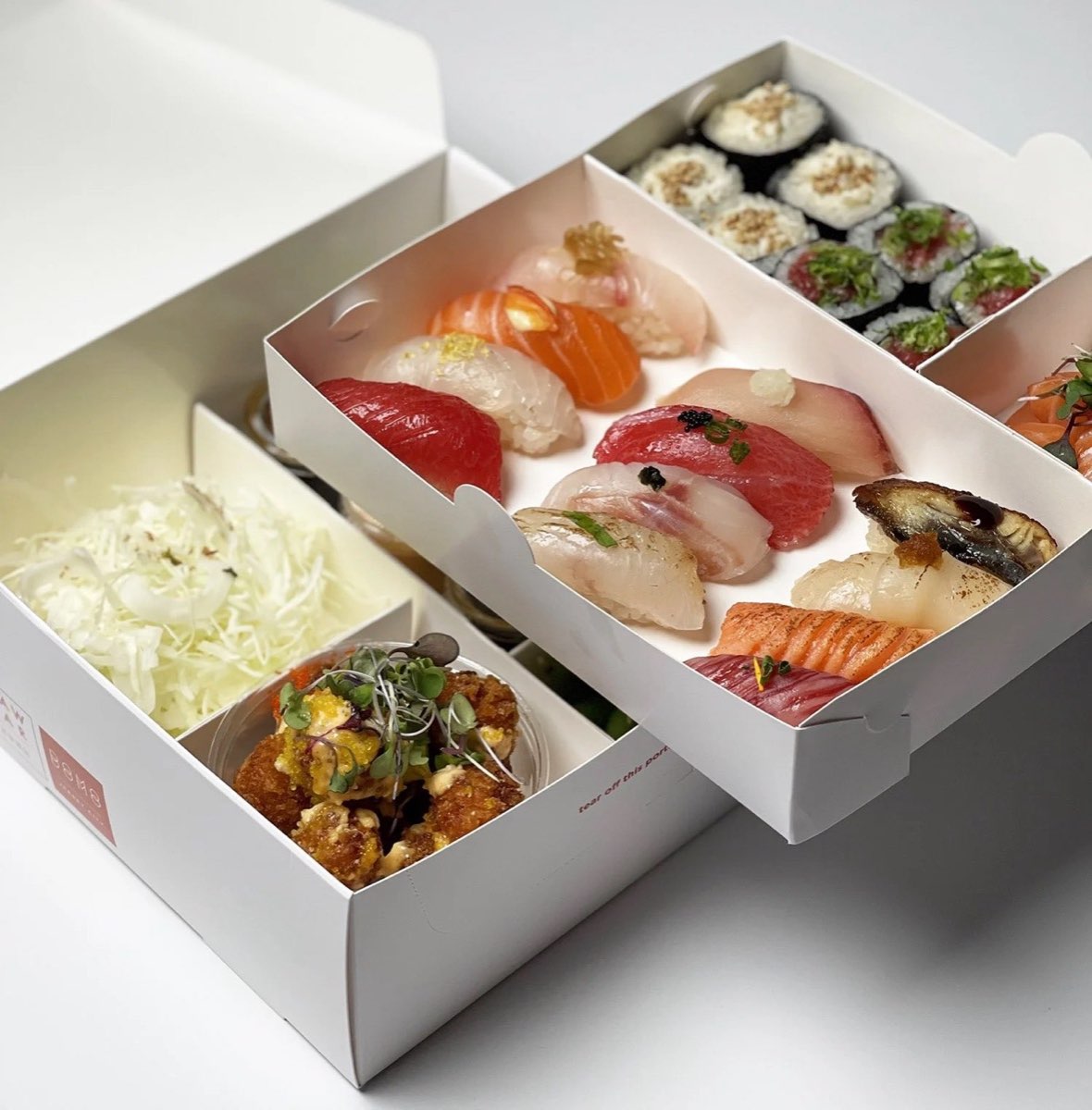 DOMODOMO: sushi and sashimi boxes from above. Photo from their website.