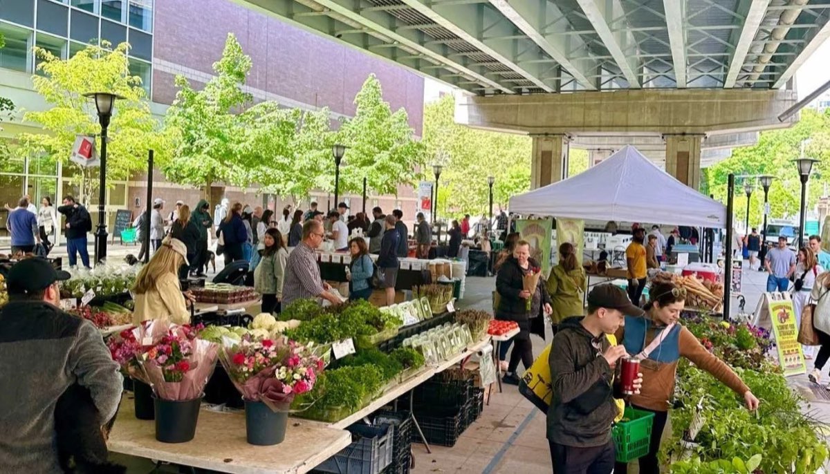 Hoboken Farmers Market: market stalls under the viaduct with shoppers. Photo from their website.