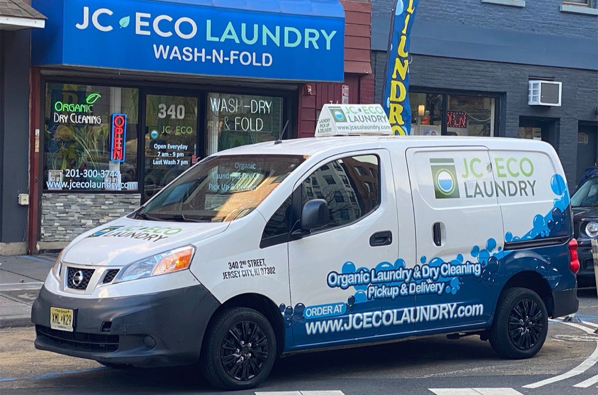 JC Eco Laundry: storefront with the branded delivery van outside. Photo from their website.